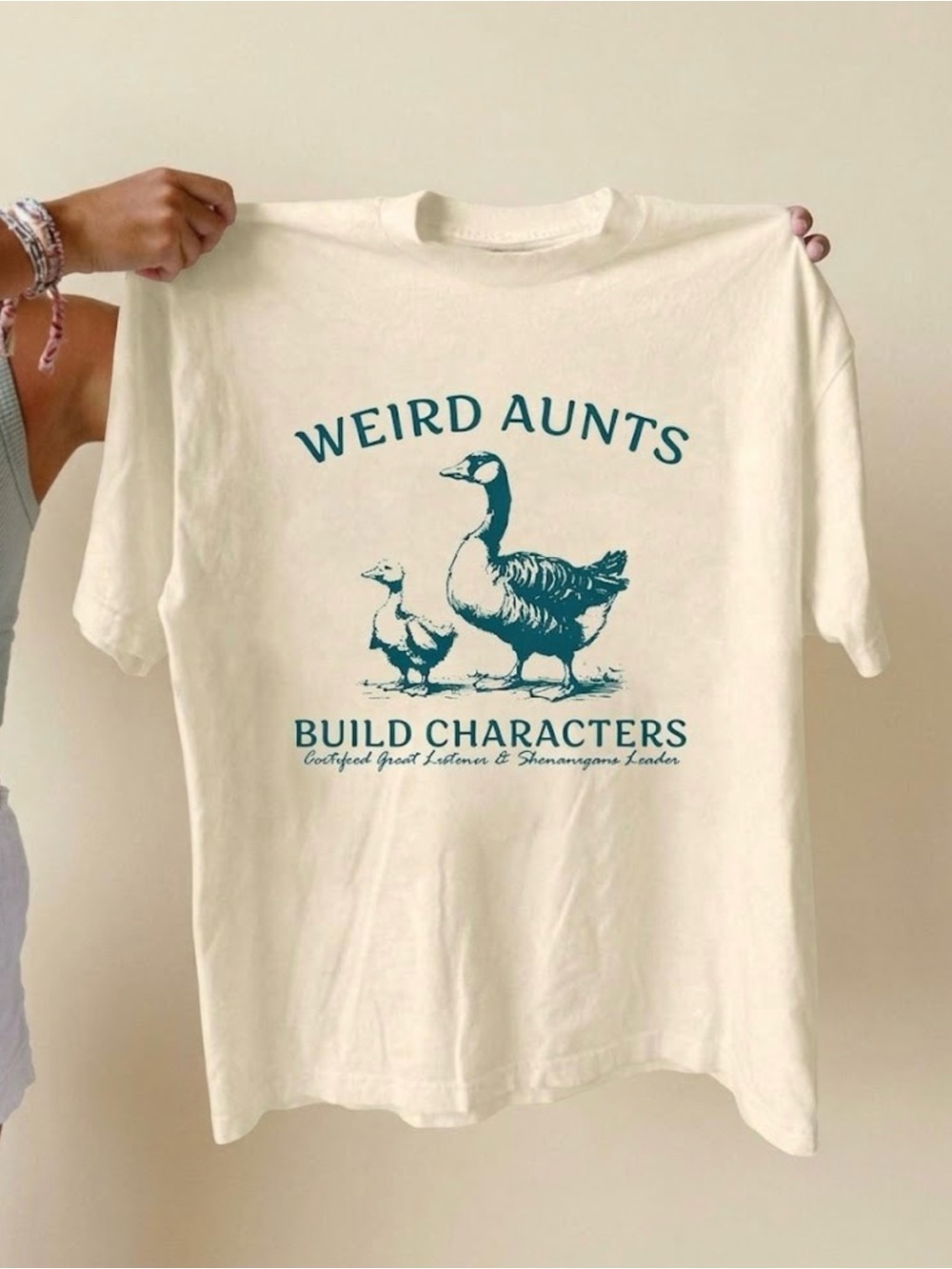 Silly Goose Weird Aunts Build Characters Cream Graphic Tee
